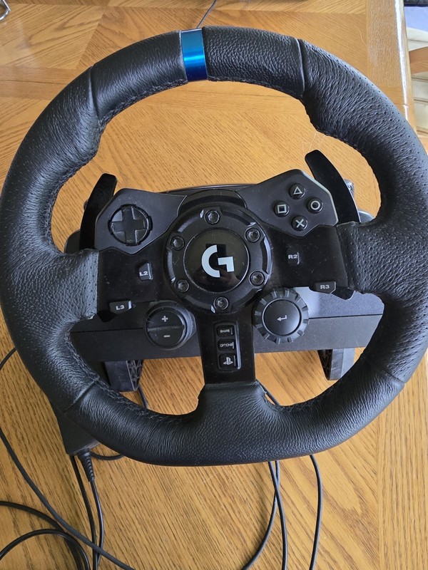 Logitech G923 Racing Wheel And Pedals. Works perfectly light use