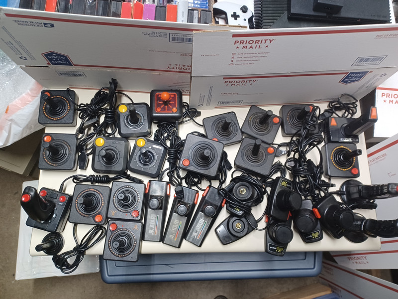 Lot of 28 Atari Controllers, Joysticks, Paddles – 26 Original & 2 later Wireless